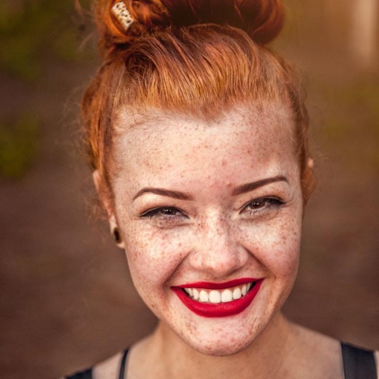 Kaveri Mehta, Lead Design Curator at Digital Growth Network, reviewing corporate floral arrangements